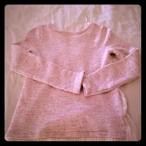 A pink sweater